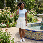 Autograph skirt standing near garden fountain