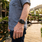 Black festive watchband along a resort garden path