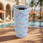 Blue Autographs tumbler beside an Italian-inspired tropical resort pool