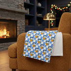 Blue Checkerboard Donald blanket on a caramel fireside armchair