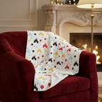Castle Celebration blanket on a red velvet fireside chair