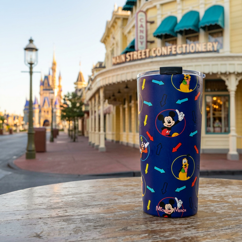 Character Arrows tumbler outside a yellow Victorian candy shop