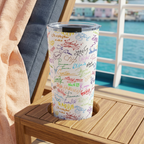 Character Autographs tumbler on a cruise lounger overlooking a pastel harbor