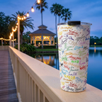 Character Autographs tumbler overlooking a glowing lakeside music pavilion