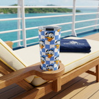 Donald tumbler on a cruise lounger overlooking a tropical island