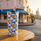 Donald tumbler outside a pink Victorian ice cream shop
