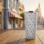 Epcot tumbler outside a pastel Victorian cafe