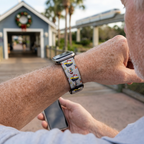 Festive cruise-pattern watchband along a nautical resort path