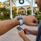 Festive watchband along a decorated resort pathway