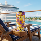 Figment tumbler on a cruise lounger overlooking a tropical port