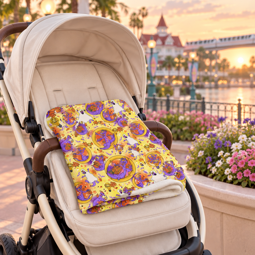 Figment yellow blanket on a cream stroller along a seaside promenade
