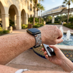 Gray illustrated watchband along a resort walkway