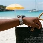 Gray illustrated watchband at a tropical beach