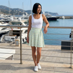 Green autograph skirt standing on marina terrace