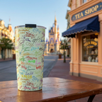Green Autographs tumbler outside an apricot Victorian tea shop