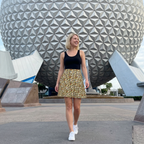 Jungle camo skirt walking near geodesic sphere