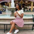 Minnie skirt at theme park fountain plaza