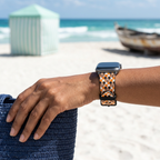 Orange checkerboard watchband at a tropical beach