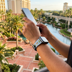 Pale blue festive watchband at a resort garden overlook