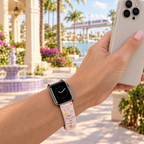 Pink autograph watchband along a resort colonnade