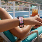 Pink bow-pattern watchband on a cruise deck