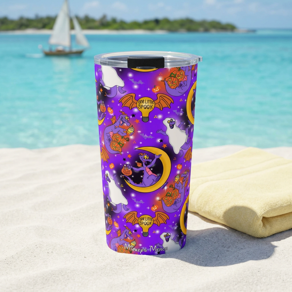 Purple Figment tumbler beside a pale yellow towel overlooking a turquoise lagoon