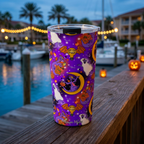 Purple Figment tumbler overlooking a glowing resort marina at blue hour