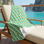 Teal Checkerboard Pluto blanket on a cruise balcony lounge chair