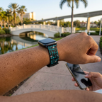 Watchband along a tropical resort pathway