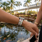 White festive watchband along a resort footbridge
