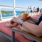 White festive watchband on a cruise deck